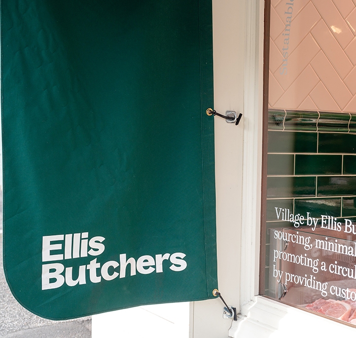 Ellis butchers green sign outside shop