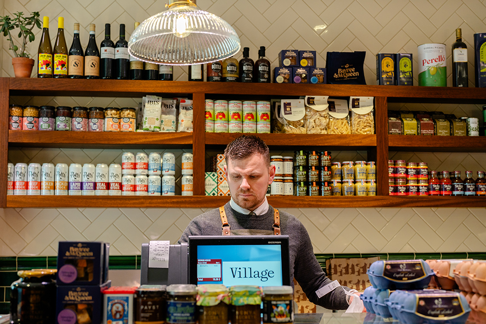 man working on counter at ellis butchers